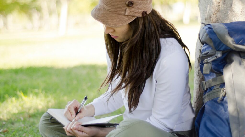 woman writing in journal