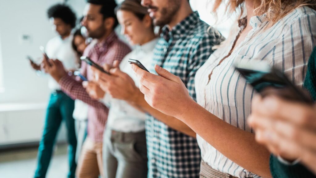 group of people looking at phones